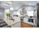 Modern kitchen featuring white cabinets, granite countertops, and stainless steel appliances at 218 Ward Rd, Ellenwood, GA 30294