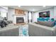 Inviting living room featuring a decorative fireplace, plush seating, and a stylish accent rug at 218 Ward Rd, Ellenwood, GA 30294