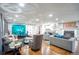 Spacious open-concept living room seamlessly connects kitchen and dining areas with stylish and comfortable seating at 218 Ward Rd, Ellenwood, GA 30294