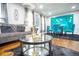 Inviting living room featuring a plush sofa, modern decor, and a stylish glass-top coffee table at 218 Ward Rd, Ellenwood, GA 30294