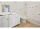 Neat bathroom with white vanity, toilet and bathtub at 2211 Westchester Rdg, Atlanta, GA 30329