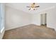 Well-lit bedroom featuring a ceiling fan and ample space at 2211 Westchester Rdg, Atlanta, GA 30329