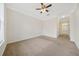 Spacious carpeted bedroom with ceiling fan and large window at 2211 Westchester Rdg, Atlanta, GA 30329