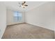 Spacious bedroom with neutral carpeting and large window at 2211 Westchester Rdg, Atlanta, GA 30329