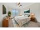 Bright bedroom with ceiling fan and large window at 2211 Westchester Rdg, Atlanta, GA 30329