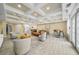 Bright and airy community room features comfortable seating areas and a kitchenette at 2211 Westchester Rdg, Atlanta, GA 30329