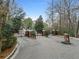 Gated community entrance with brick pavers and lush landscaping at 2211 Westchester Rdg, Atlanta, GA 30329