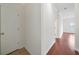 Clean hallway with hardwood floors and neutral walls at 2211 Westchester Rdg, Atlanta, GA 30329