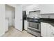 Kitchen with stainless steel appliances and white cabinets at 2211 Westchester Rdg, Atlanta, GA 30329