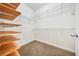 Walk-in closet with wood shelves and wire racks at 2211 Westchester Rdg, Atlanta, GA 30329