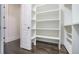 Walk-in closet with built in shelves and racks, offering ample storage space at 275 Pineland Nw Rd, Atlanta, GA 30342