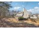 House exterior view, showcasing backyard and screened porch at 2905 Brookwater Dr, Cumming, GA 30041