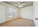 Spacious bedroom featuring a ceiling fan and large window at 2905 Brookwater Dr, Cumming, GA 30041