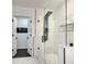 Modern bathroom with a large walk-in shower and marble flooring at 2705 Baker Ridge Nw Dr, Atlanta, GA 30318