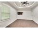 Bedroom with hardwood floors, window, and built-in shelving at 2705 Baker Ridge Nw Dr, Atlanta, GA 30318