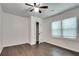 Bright bedroom featuring hardwood floors and spacious closet at 2705 Baker Ridge Nw Dr, Atlanta, GA 30318