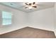 Well-lit bedroom with hardwood floors and a window with blinds at 2705 Baker Ridge Nw Dr, Atlanta, GA 30318