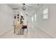 Modern dining room with glass table and open concept design at 2705 Baker Ridge Nw Dr, Atlanta, GA 30318