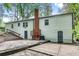 Rear view of house showing patio and landscaping at 2705 Baker Ridge Nw Dr, Atlanta, GA 30318