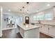 Modern kitchen with an island, white cabinets and stainless steel appliances at 2705 Baker Ridge Nw Dr, Atlanta, GA 30318