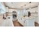 Renovated kitchen, featuring white cabinets, granite island, and stainless steel appliances at 2705 Baker Ridge Nw Dr, Atlanta, GA 30318