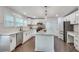 Modern kitchen with white cabinets, granite counters, and stainless steel appliances at 2705 Baker Ridge Nw Dr, Atlanta, GA 30318