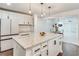 Modern kitchen with white cabinets, granite island, and stainless steel appliances at 2705 Baker Ridge Nw Dr, Atlanta, GA 30318