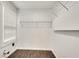 Bright laundry room with wire shelving and tile flooring at 2705 Baker Ridge Nw Dr, Atlanta, GA 30318