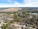 Wide aerial view showing the property and surrounding landscape at 5737 Riverside Dr, Sugar Hill, GA 30518