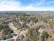 Wide aerial view of neighborhood, showcasing the community's layout and surrounding landscape at 5737 Riverside Dr, Sugar Hill, GA 30518