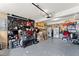 Spacious garage with ample storage shelving and overhead cabinets at 5737 Riverside Dr, Sugar Hill, GA 30518