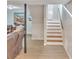 Basement stairs with wood treads and neutral walls at 6460 Boca Grande Blvd, Forest Park, GA 30297