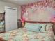 Charming bedroom with floral wall art and ample closet space at 6460 Boca Grande Blvd, Forest Park, GA 30297