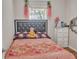 Charming bedroom with floral bedding and a dresser at 6460 Boca Grande Blvd, Forest Park, GA 30297