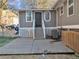 Backyard patio featuring modern architecture with unique window design and grey siding at 6460 Boca Grande Blvd, Forest Park, GA 30297