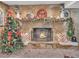 Charming stone fireplace adorned with festive decorations, perfect for cozy gatherings and holiday cheer at 6460 Boca Grande Blvd, Forest Park, GA 30297