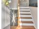 Bright foyer with hardwood stairs and natural light at 6460 Boca Grande Blvd, Forest Park, GA 30297