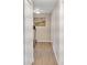 Clean hallway with white walls and baseboard leads to various rooms at 6460 Boca Grande Blvd, Forest Park, GA 30297