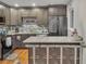 Well-lit kitchen showcasing granite countertops, stainless steel appliances, and a functional breakfast bar at 6460 Boca Grande Blvd, Forest Park, GA 30297