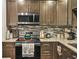 Corner kitchen with updated cabinets and tile backsplash at 6460 Boca Grande Blvd, Forest Park, GA 30297