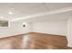 Finished basement with neutral walls and wood flooring at 1195 Old Woodbine Rd, Atlanta, GA 30319