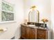 Updated bathroom with dark vanity, granite countertop, and arched mirror at 1195 Old Woodbine Rd, Atlanta, GA 30319