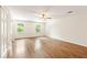 Spacious bedroom featuring hardwood floors and a ceiling fan at 1195 Old Woodbine Rd, Atlanta, GA 30319