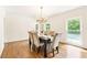 Bright dining room with hardwood floors, chandelier, and six-person table at 1195 Old Woodbine Rd, Atlanta, GA 30319