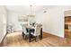 Formal dining room with hardwood floors, chandelier, and six-person table at 1195 Old Woodbine Rd, Atlanta, GA 30319