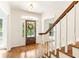 Elegant entryway with hardwood floors, arched doorway and wooden staircase at 1195 Old Woodbine Rd, Atlanta, GA 30319