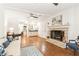 Gathering room featuring hardwood floors, stone fireplace, and built-in cabinetry at 1195 Old Woodbine Rd, Atlanta, GA 30319