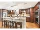 Kitchen with granite countertops, stainless steel appliances, and hardwood floors at 1195 Old Woodbine Rd, Atlanta, GA 30319