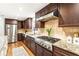 Kitchen with granite countertops, stainless steel appliances, and hardwood floors at 1195 Old Woodbine Rd, Atlanta, GA 30319