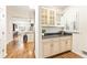 Wet bar with granite countertop and custom cabinetry at 1195 Old Woodbine Rd, Atlanta, GA 30319